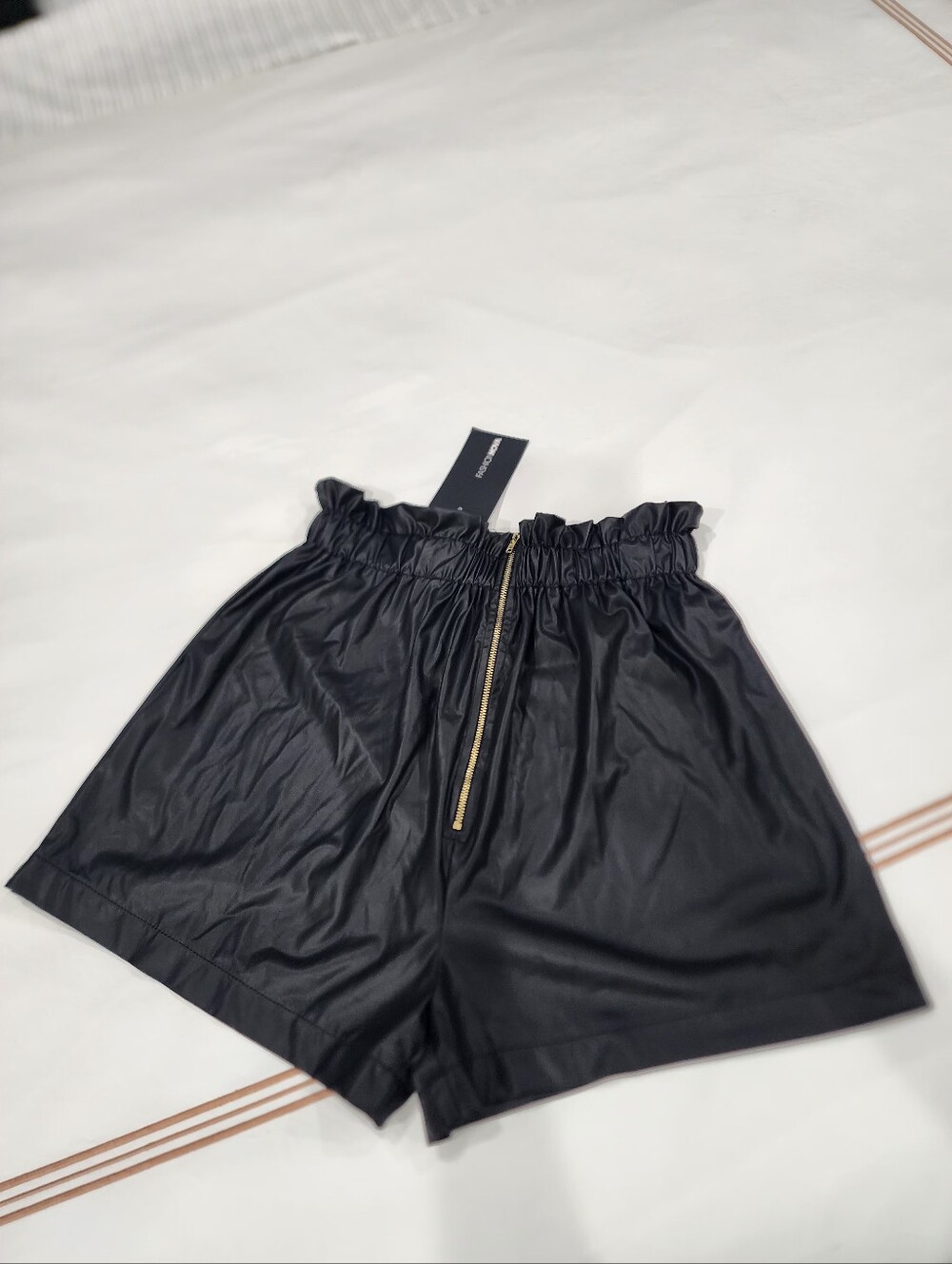 Black Faux Leather High-Waist Paperbag Shorts with Gold Zip. Final Price